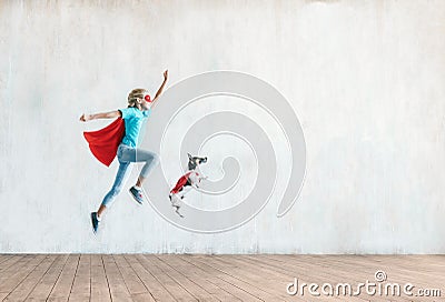 Jumping little child with a dog Stock Photo