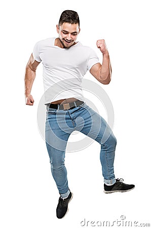 Jumping Man Full Body on White Background, Boy in Jump, Casual T Shirt Jeans Stock Photo