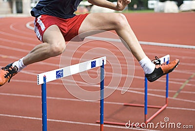 Jumping over the hurdle Stock Photo