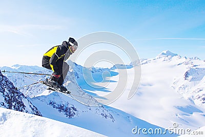 Jumping skier at mountains Stock Photo