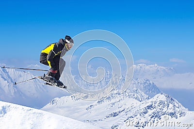 Jumping skier at mountains Stock Photo