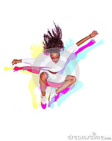 Jumping stylish mixed race young girl on white background. Rainbow colourful studio light. Fiery hip hop dance leap Stock Photo
