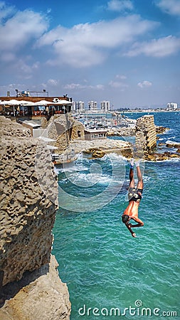 Jumping to the sea Editorial Stock Photo