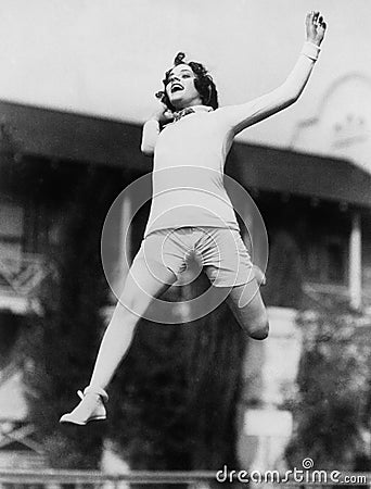 Jumping woman in midair Stock Photo