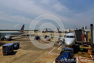 Front view of landed airplane in a terminal of Airplane from American Airlines AA on the tarmac at the International Airport Editorial Stock Photo