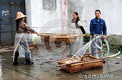 Jun Le Town, China: Washing Wicker Baskets Editorial Stock Photo