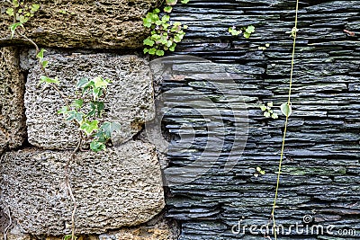 Junction of walls with two different textures. Layers of uneven Stock Photo