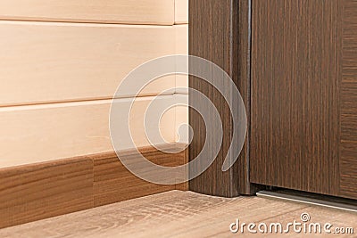 Junction of wooden walls, floor and interior doors Stock Photo