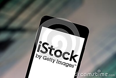 June 22, 2019, Brazil. In this photo illustration the iStock logo is displayed on a smartphone Cartoon Illustration