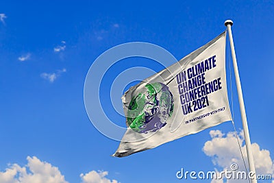 June 7, 2020, Brazil. In this photo illustration the 2021 United Nations Climate Change Conference COP26 soon appears on a flag Cartoon Illustration