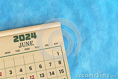 June 2024 calendar flat lay in blue background with copy space. Stock Photo