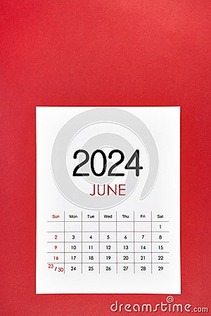 June 2024 calendar page with push pin on red Stock Photo