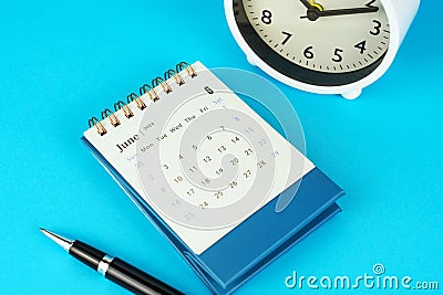 June 2024 Desk Calendar on Blue Background Stock Photo