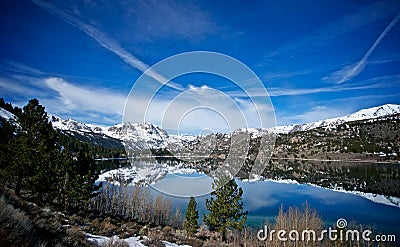 June Lake Wreathed in Snow Stock Photo