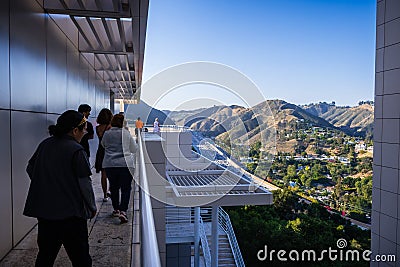 June 8, 2018 Los Angeles / CA / USA - Group of visitors on the free architectural tour at Getty Center; the highway and nearby Editorial Stock Photo