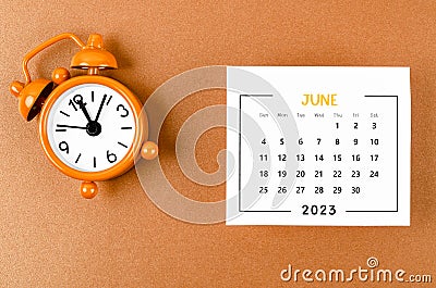 The June 2023 Monthly calendar for the organizer to plan 2023 year with alarm clock on yellow background Stock Photo