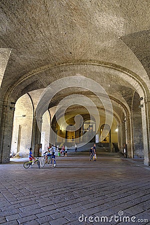 June 2022 Parma, Italy: Entrance and stairs of the Palace Palazzo Pilotta across the arches, columns, and visitors Editorial Stock Photo