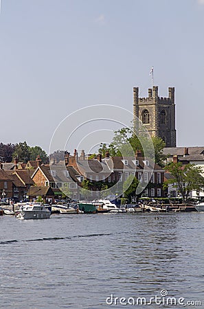 St Mary's Church of England tower overlooking the Thames with its boats and barges Editorial Stock Photo