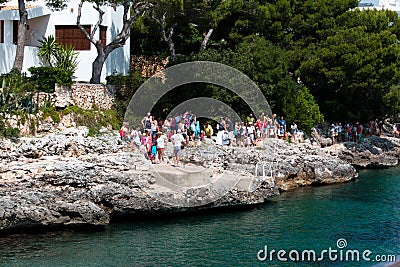 June 16th, 2017, Cala D`or, Mallorca, Spain - Starfish sea adventure boat ride arriving to pick up passengers Editorial Stock Photo