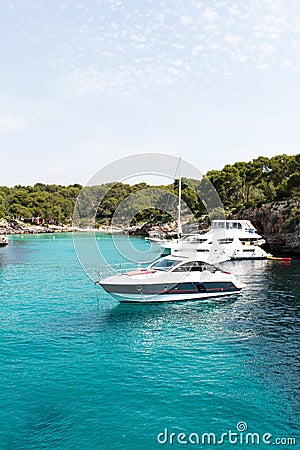 June 16th, 2017, Cala Sanau, Mallorca, Spain - boats parked near the beach Editorial Stock Photo