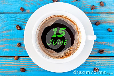 June 15th. Day 15 of month, everyday calendar written on morning coffee cup at blue wooden background. Summer concept Stock Photo