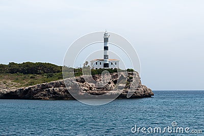 June 16th, 2017, Porto Colom, Mallorca, Spain - coastline view with lighthouse Editorial Stock Photo