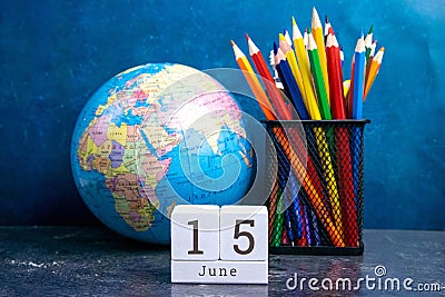 June 15 on the wooden calendar.The fifteenth day of the summer month, a calendar for the workplace. Summer Stock Photo