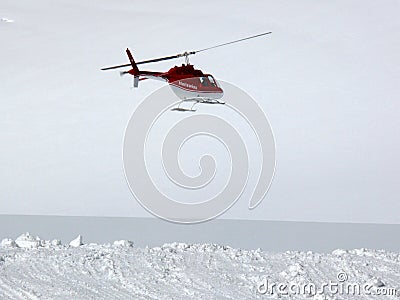 Jungfrau, Switzerlan, 08/06/2009. Red helicopter on high mountai Editorial Stock Photo