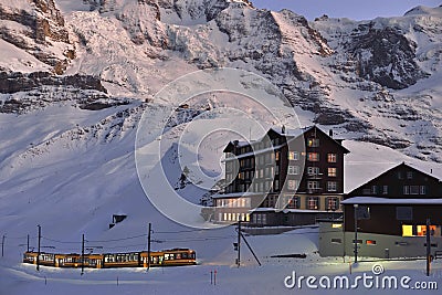 Jungfraubahn ariving in Kleine Scheidegg station. Swiss Alps Stock Photo