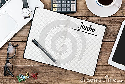 Junho Portuguese June month name on paper note pad at office d Stock Photo