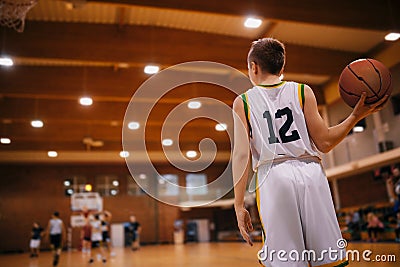 Junior Basketball Players on a Game. Male Elementary School Basketball Team Playing Game Editorial Stock Photo