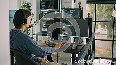 Junior developer programming code on terminal window, typing server information Stock Photo