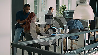 Junior developer working on terminal window to code system script Stock Photo