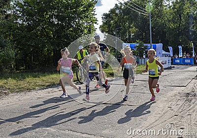 Junior female athletics runner. Running race competition Editorial Stock Photo