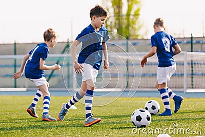 Junior Football Players Making Sports Training, Happy Boys on Soccer Practice Session on Summer Time Stock Photo