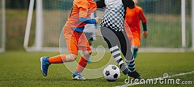 Junior Soccer Match Duel. Football Game For Youth Players. Boys Playing Soccer Match on Football Pitch Stock Photo