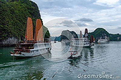 Junk boats berthing at Surprise Cave Bay in Ha Long Bay, Vietnam Editorial Stock Photo