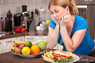 Junk food or healthy food,concept of pregnant woman on a diet Stock Photo