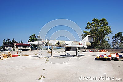 A junk yard with a retired jet fighter in Sicily, italy Editorial Stock Photo