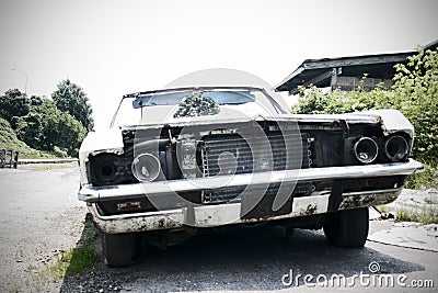 Junked Car - focus in the background Stock Photo