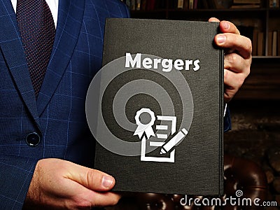 Juridical concept about Mergers with sign on the page Stock Photo