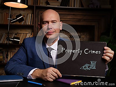 Juridical concept about Property Crimes with phrase on the page Stock Photo