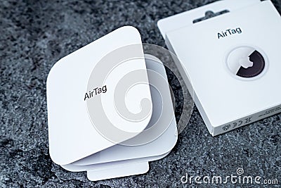Jurmala, Latvia - 21 09 2023: Box with AirTag Apple on table. Air Tag gadget to track of your stuff . Editorial Stock Photo