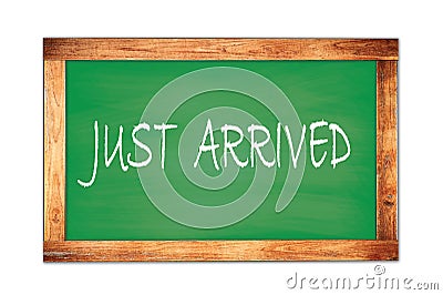 JUST ARRIVED text written on green school board Stock Photo