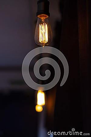 Just a light bulb hanging in a bar. Stock Photo