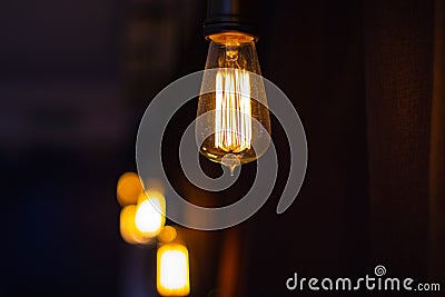Just a light bulb hanging in a bar. Stock Photo