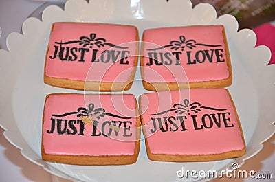 Just love decor on four pink cookies Stock Photo