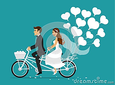 Just married couple bride and groom riding tandem bike Stock Photo