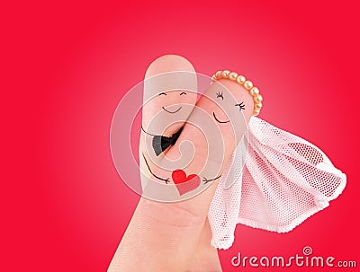 Just married couple - newlyweds painted at fingers Stock Photo