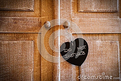 Just married or Do not disturb heart on vintage wood door Stock Photo
